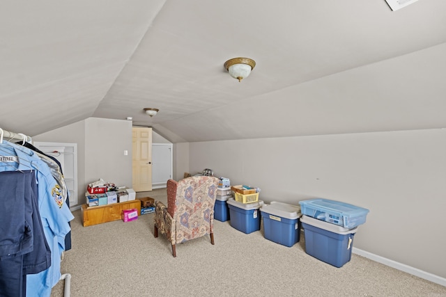 additional living space with vaulted ceiling, carpet flooring, and baseboards