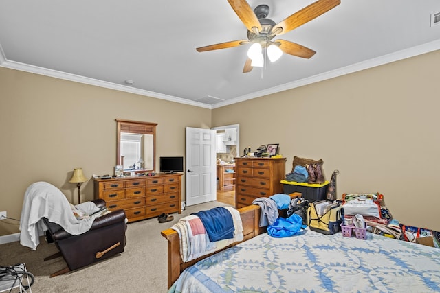 carpeted bedroom featuring visible vents, ceiling fan, and crown molding