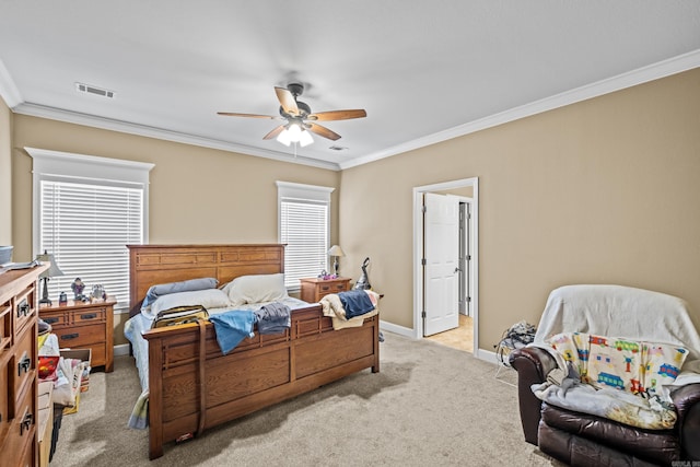 bedroom with baseboards, visible vents, carpet, a ceiling fan, and ornamental molding