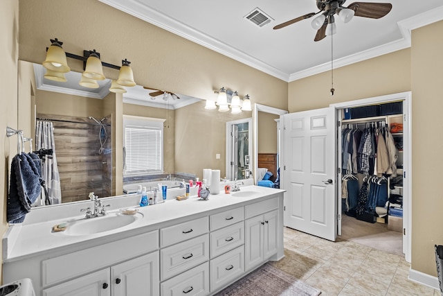 full bath with double vanity, visible vents, a sink, crown molding, and ceiling fan