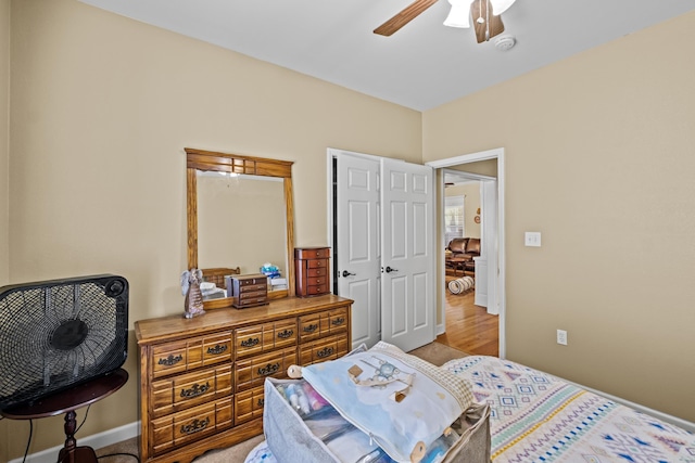 bedroom with baseboards and ceiling fan