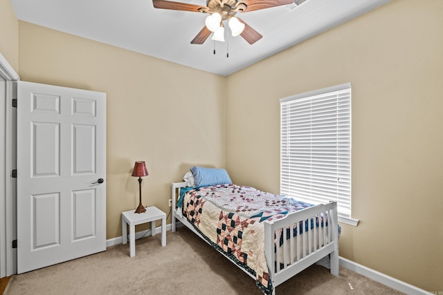 bedroom with baseboards, carpet flooring, and ceiling fan