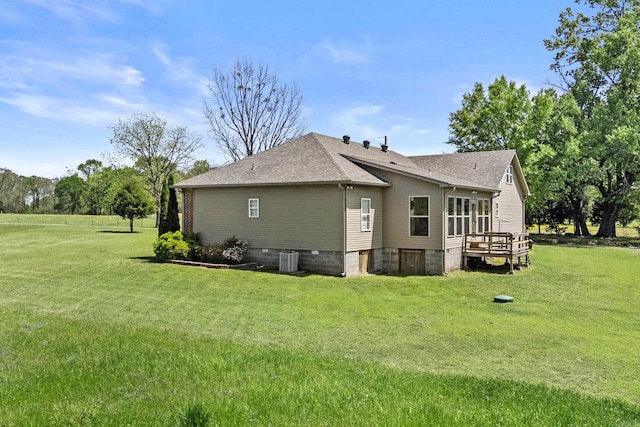 view of side of property featuring a yard, central AC, crawl space, roof with shingles, and a deck