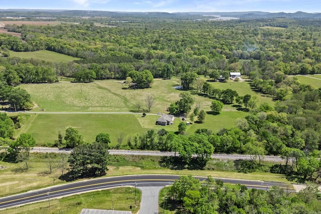 aerial view with a rural view and a view of trees