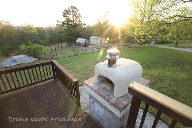 wooden deck featuring a yard