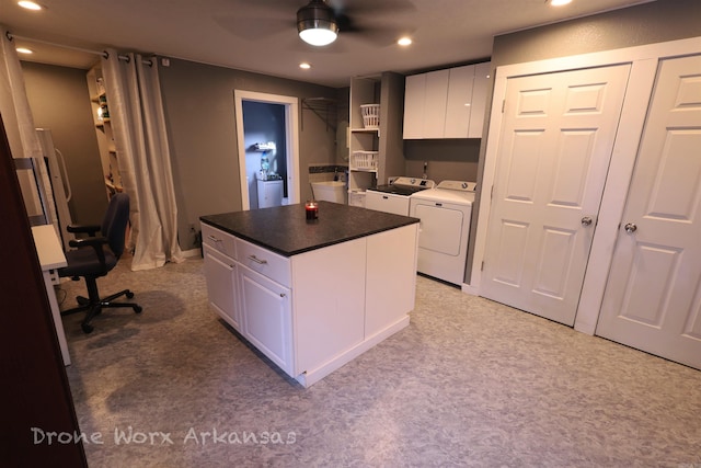 kitchen with washer and clothes dryer, recessed lighting, white cabinetry, a ceiling fan, and a kitchen island