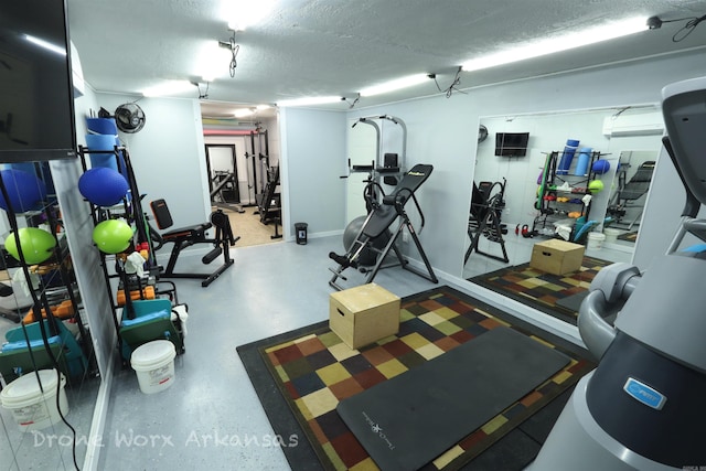 gym featuring a textured ceiling