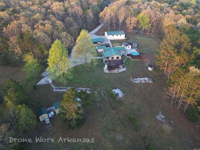 drone / aerial view featuring a view of trees