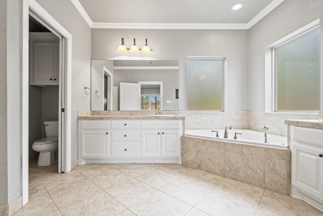 bathroom featuring a garden tub, crown molding, and vanity