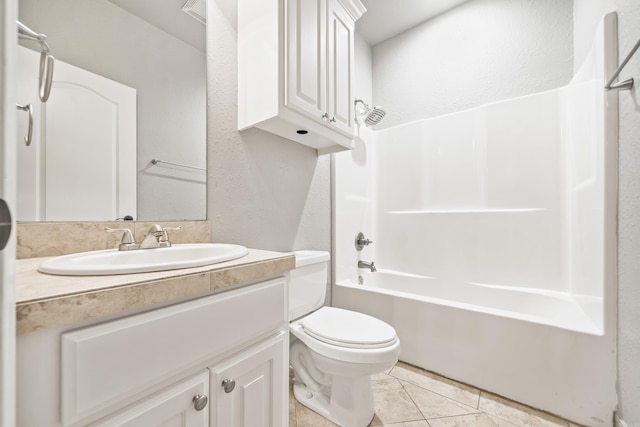 full bath with tile patterned floors, vanity, shower / tub combination, and toilet
