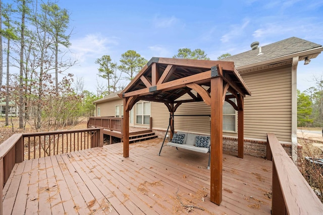 wooden terrace featuring a gazebo