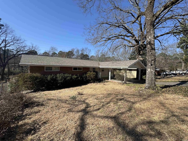 21 Belmont Dr, Little Rock, AR 72204 - ranch-style home featuring brick siding and a carport