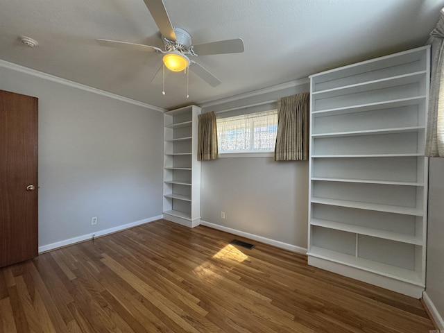 21 Belmont Dr, Little Rock, AR 72204 - unfurnished bedroom with wood finished floors, visible vents, crown molding, and baseboards