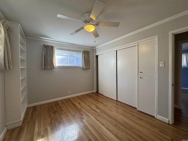 21 Belmont Dr, Little Rock, AR 72204 - unfurnished bedroom with wood finished floors, a closet, a ceiling fan, and ornamental molding