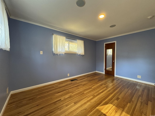 21 Belmont Dr, Little Rock, AR 72204 - unfurnished room featuring baseboards, ornamental molding, wood finished floors, and visible vents
