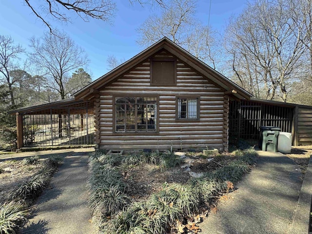 21 Belmont Dr, Little Rock, AR 72204 - view of side of home with log siding