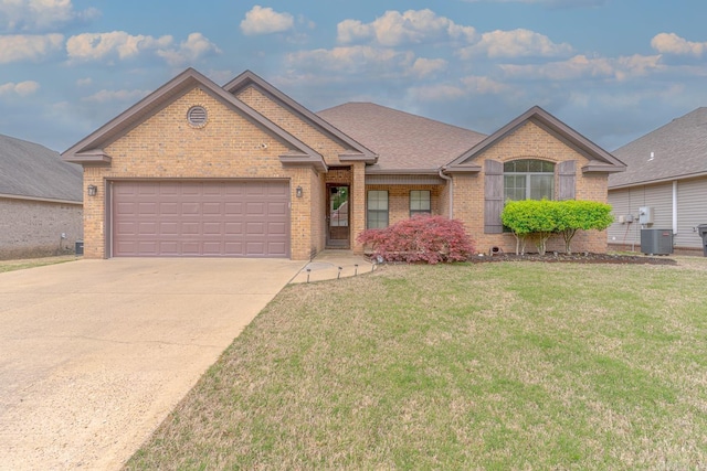 6037 Beaver Creek Ln, Jones Creek, AR 72404 - single story home featuring a front lawn, central air condition unit, concrete driveway, brick siding, and a garage