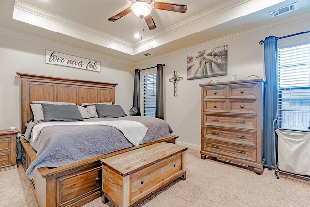 6037 Beaver Creek Ln, Jones Creek, AR 72404 - bedroom with a tray ceiling, visible vents, crown molding, and light colored carpet