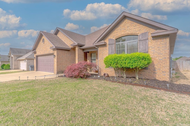 6037 Beaver Creek Ln, Jones Creek, AR 72404 - ranch-style house with brick siding, an attached garage, a front lawn, and fence