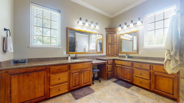 bathroom with ornamental molding, vanity, and stone finish floor