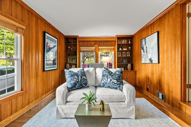 5715 Hawthorne Rd, Little Rock, AR 72207 - living area featuring wood walls, built in features, and visible vents
