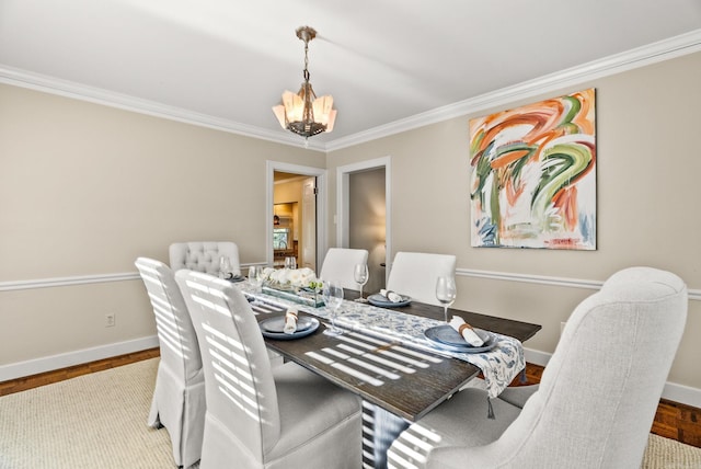 5715 Hawthorne Rd, Little Rock, AR 72207 - dining space with a chandelier, wood finished floors, baseboards, and ornamental molding