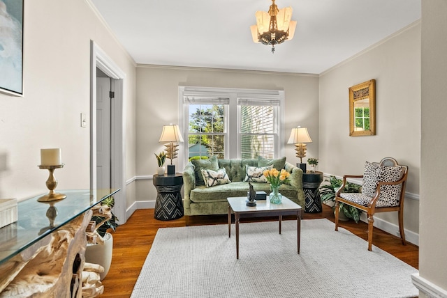 5715 Hawthorne Rd, Little Rock, AR 72207 - living area featuring wood finished floors, crown molding, baseboards, and a notable chandelier