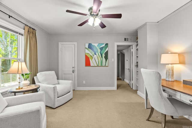 5715 Hawthorne Rd, Little Rock, AR 72207 - home office with crown molding, ceiling fan, light colored carpet, baseboards, and visible vents