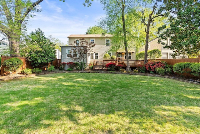 5715 Hawthorne Rd, Little Rock, AR 72207 - rear view of house with fence, a lawn, and a deck