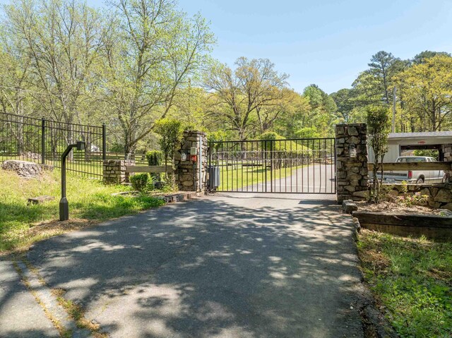 view of gate with fence