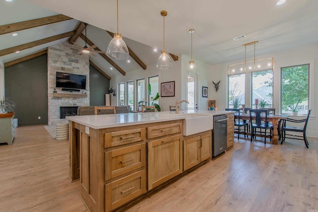 4941 Lake Vista Dr, Benton, AR 72019 - kitchen with light wood-type flooring, visible vents, open floor plan, and a sink