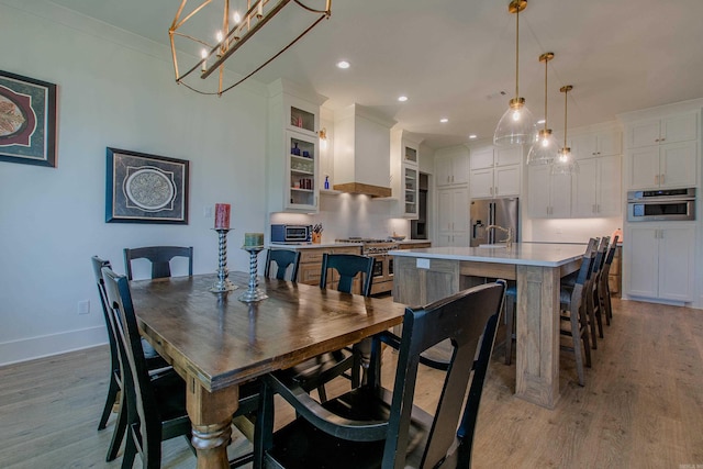 4941 Lake Vista Dr, Benton, AR 72019 - dining space featuring a chandelier, a toaster, light wood-style flooring, baseboards, and recessed lighting