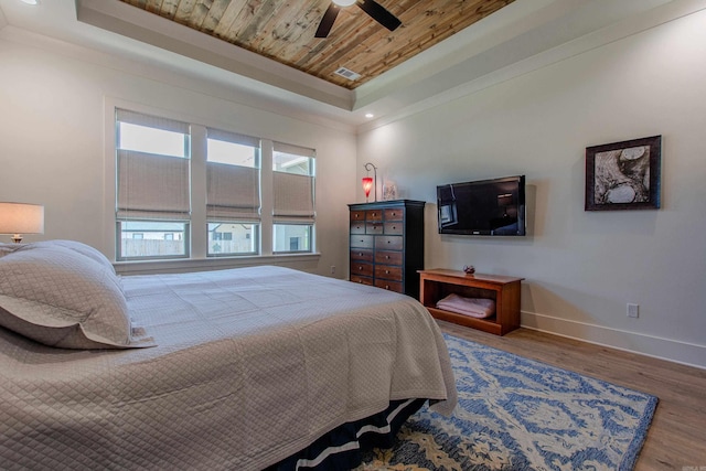 4941 Lake Vista Dr, Benton, AR 72019 - bedroom featuring a tray ceiling, baseboards, wood ceiling, and wood finished floors