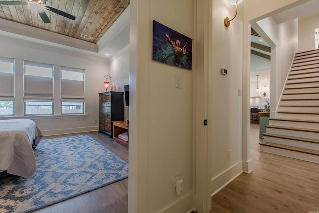 4941 Lake Vista Dr, Benton, AR 72019 - bedroom with a raised ceiling, wood finished floors, wood ceiling, and baseboards