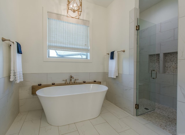 4941 Lake Vista Dr, Benton, AR 72019 - full bathroom with a shower stall, marble finish floor, a soaking tub, and tile walls
