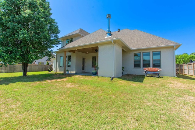 4941 Lake Vista Dr, Benton, AR 72019 - rear view of property featuring a fenced backyard, brick siding, a ceiling fan, and a lawn