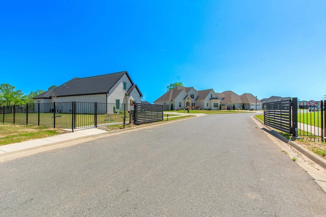 4941 Lake Vista Dr, Benton, AR 72019 - view of road featuring sidewalks, curbs, a gate, and a residential view