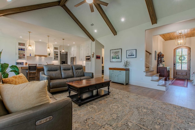 4941 Lake Vista Dr, Benton, AR 72019 - living room featuring stairway, high vaulted ceiling, wood finished floors, ceiling fan, and beamed ceiling
