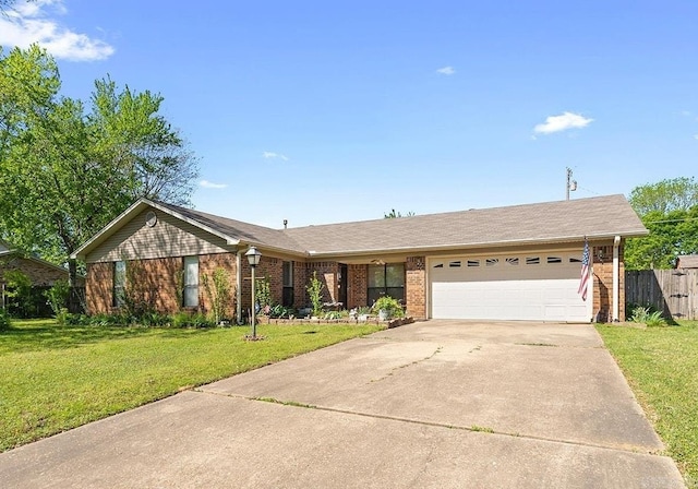 15 Falcon Dr, Sherwood, AR 72120 - ranch-style house featuring brick siding, an attached garage, driveway, and a front lawn