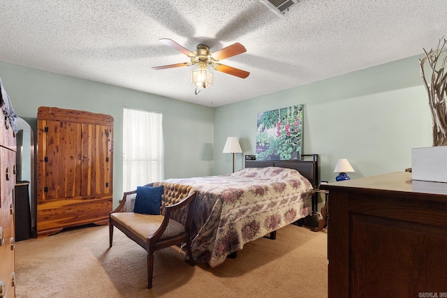 15 Falcon Dr, Sherwood, AR 72120 - bedroom featuring a ceiling fan, visible vents, a textured ceiling, and light colored carpet