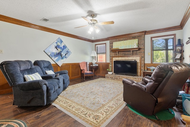 15 Falcon Dr, Sherwood, AR 72120 - living area featuring a textured ceiling, dark wood-style floors, ornamental molding, and wainscoting