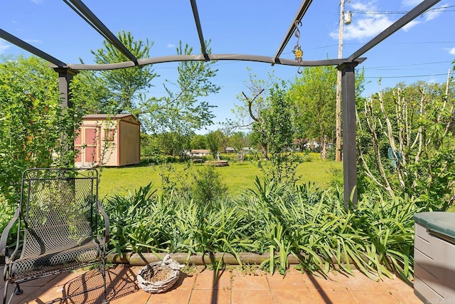 15 Falcon Dr, Sherwood, AR 72120 - view of yard featuring a storage unit and an outbuilding