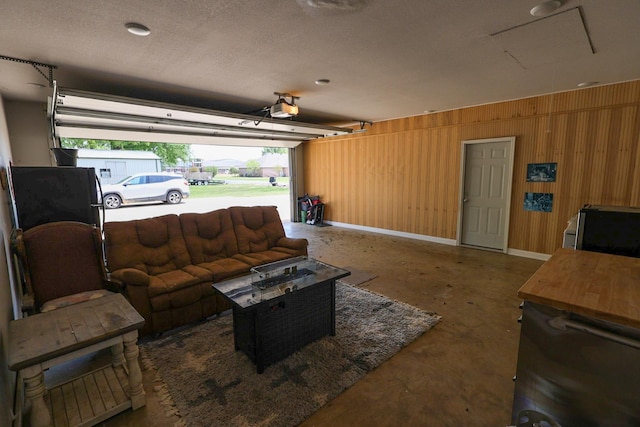 garage with a garage door opener and baseboards
