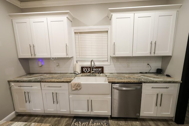 kitchen with a sink, dishwasher, white cabinetry, backsplash, and ornamental molding