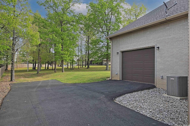 2780 Shoemaker Rd, Sheridan, AR 72150 - garage featuring driveway and central AC unit
