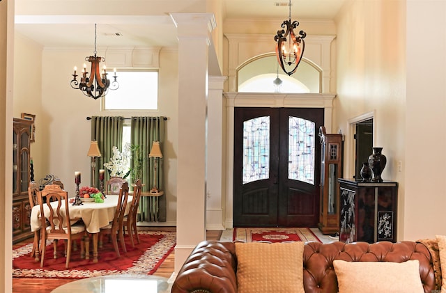 2780 Shoemaker Rd, Sheridan, AR 72150 - foyer featuring french doors, a towering ceiling, a chandelier, and ornamental molding