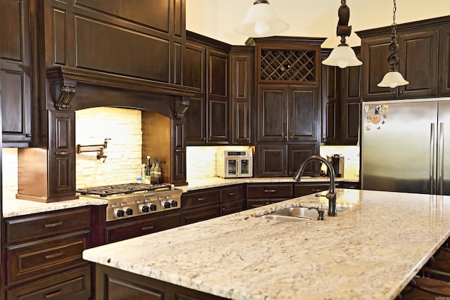 2780 Shoemaker Rd, Sheridan, AR 72150 - kitchen with light stone countertops, stainless steel appliances, a sink, and dark brown cabinets