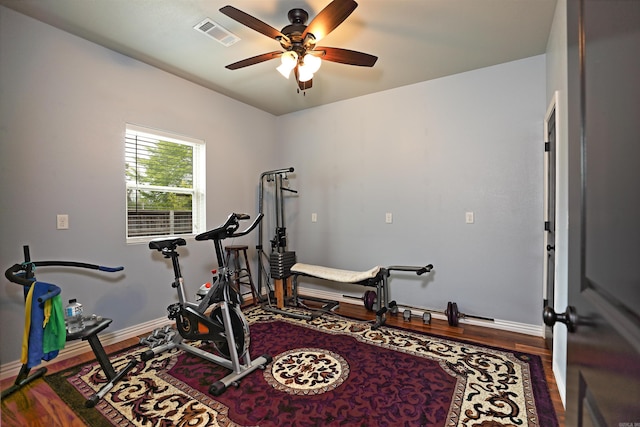 2780 Shoemaker Rd, Sheridan, AR 72150 - workout area featuring visible vents, baseboards, wood finished floors, and ceiling fan