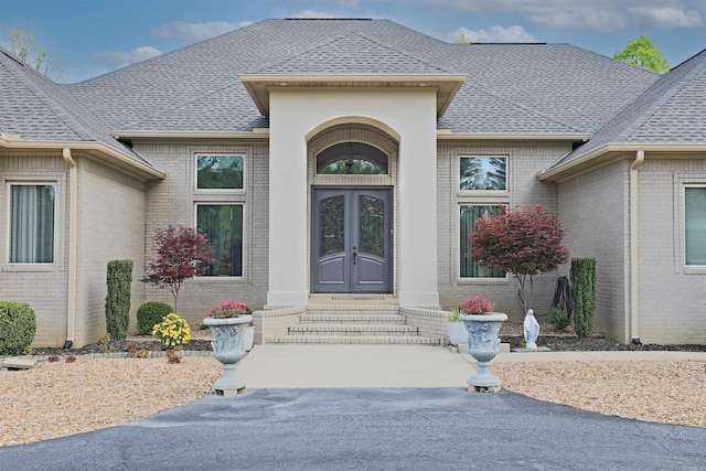 2780 Shoemaker Rd, Sheridan, AR 72150 - view of exterior entry with brick siding and a shingled roof