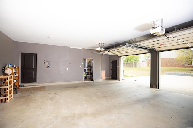 2780 Shoemaker Rd, Sheridan, AR 72150 - garage with a garage door opener and baseboards